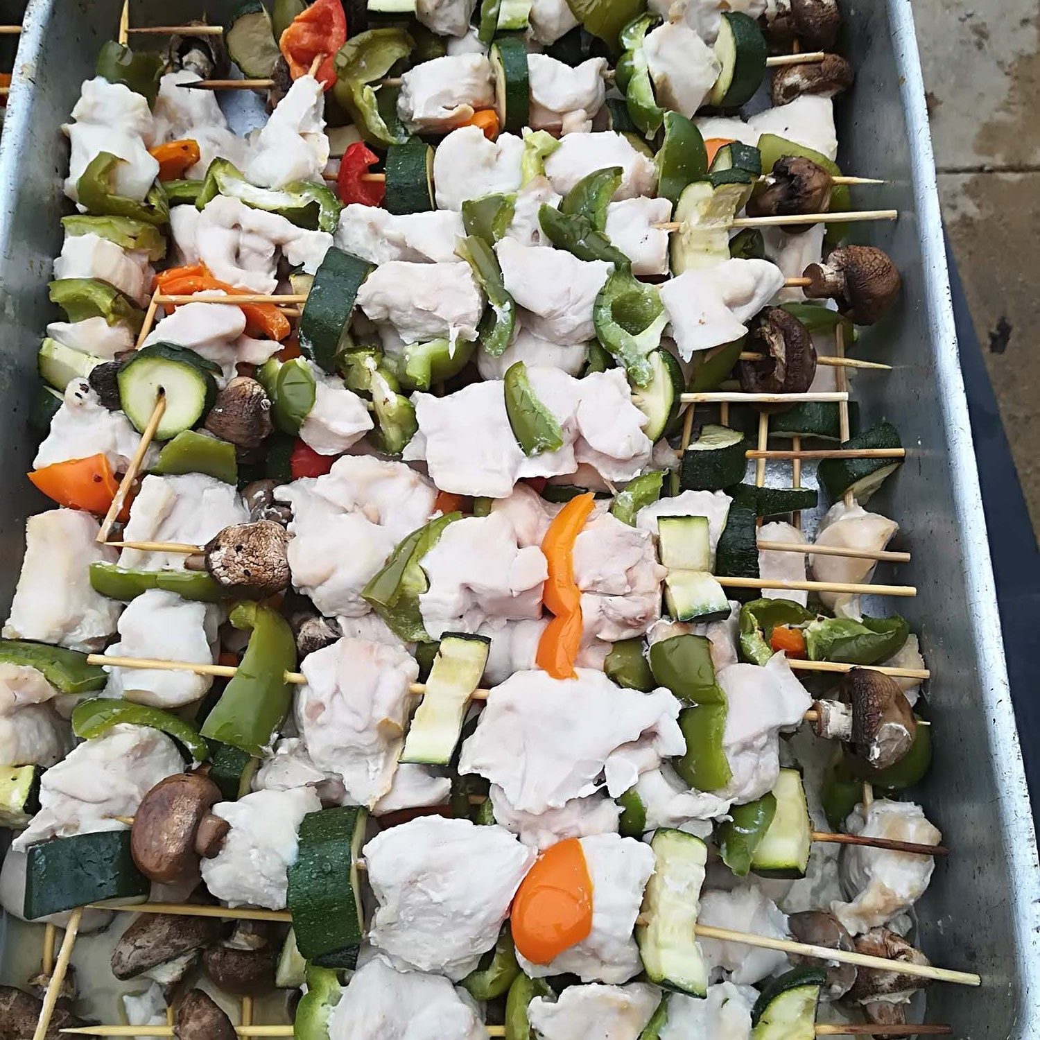 Raw chicken kebabs prepared for cooking